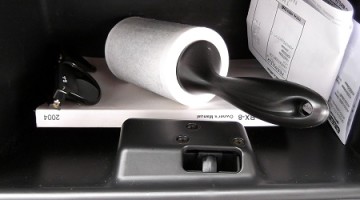 Dapper or Dorky: Keeping a lint roller in your glovebox.