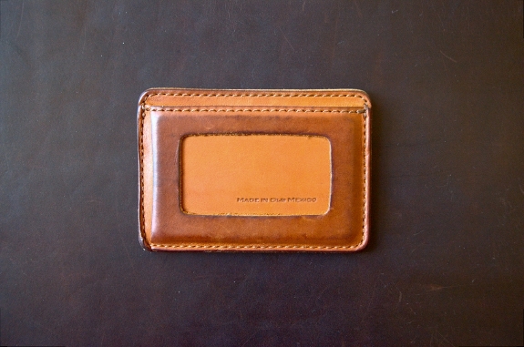 Wallet in tobacco brown on thin briefcase in dark coffee brown.