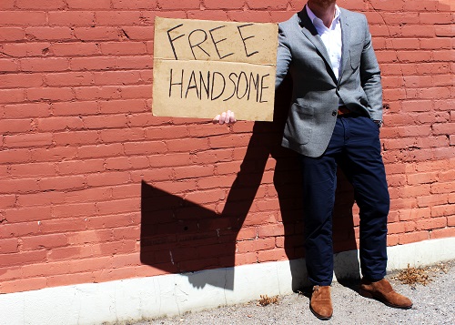 Best use of a discarded box that used to hold ground buffalo found in an alley dumpster: Free Handsome Sign
