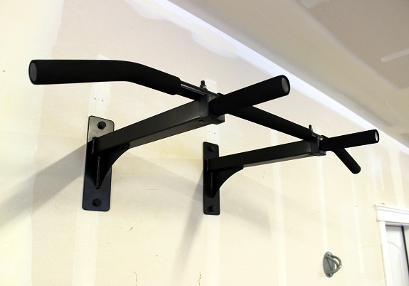 Pullup bar attached to wall
